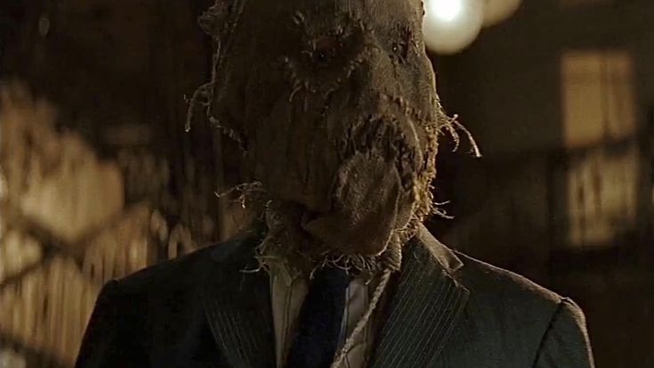 Scene from Warner Bros.' Batman Begins: Jonathan Crane dons the mask as Scarecrow